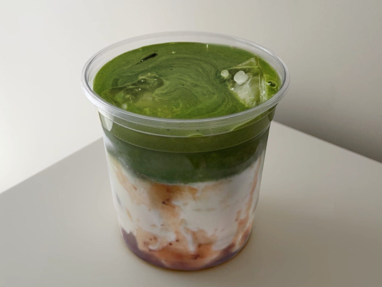 Matcha over strawberry compote and cream